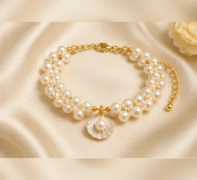 White pearl bracelet with shell charm