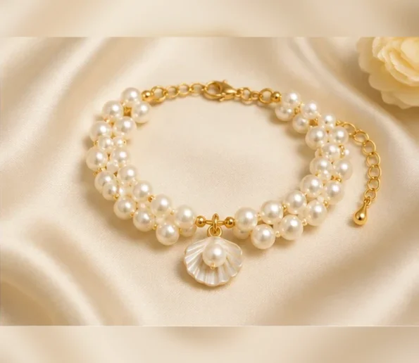 White pearl bracelet with shell charm