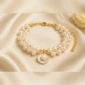 White pearl bracelet with shell charm