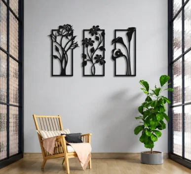 Modern interior with black floral wall art, wooden chair, green indoor plant, and large windows.