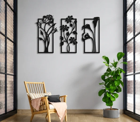 Modern interior with black floral wall art, wooden chair, green indoor plant, and large windows.