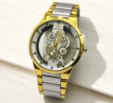 Gold and silver skeleton watch with intricate mechanical gears and metal bracelet