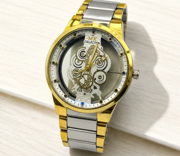 Gold and silver skeleton watch with intricate mechanical gears and metal bracelet