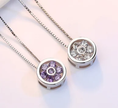 Elegant silver pendant necklaces with crystal flower designs