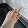 Elegant gold floral ring worn on a hand