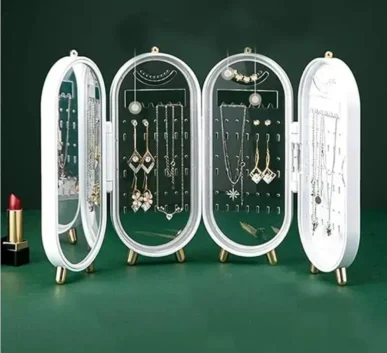 Elegant jewelry display case with assorted necklaces and earrings