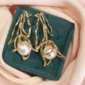 Gold pearl earrings