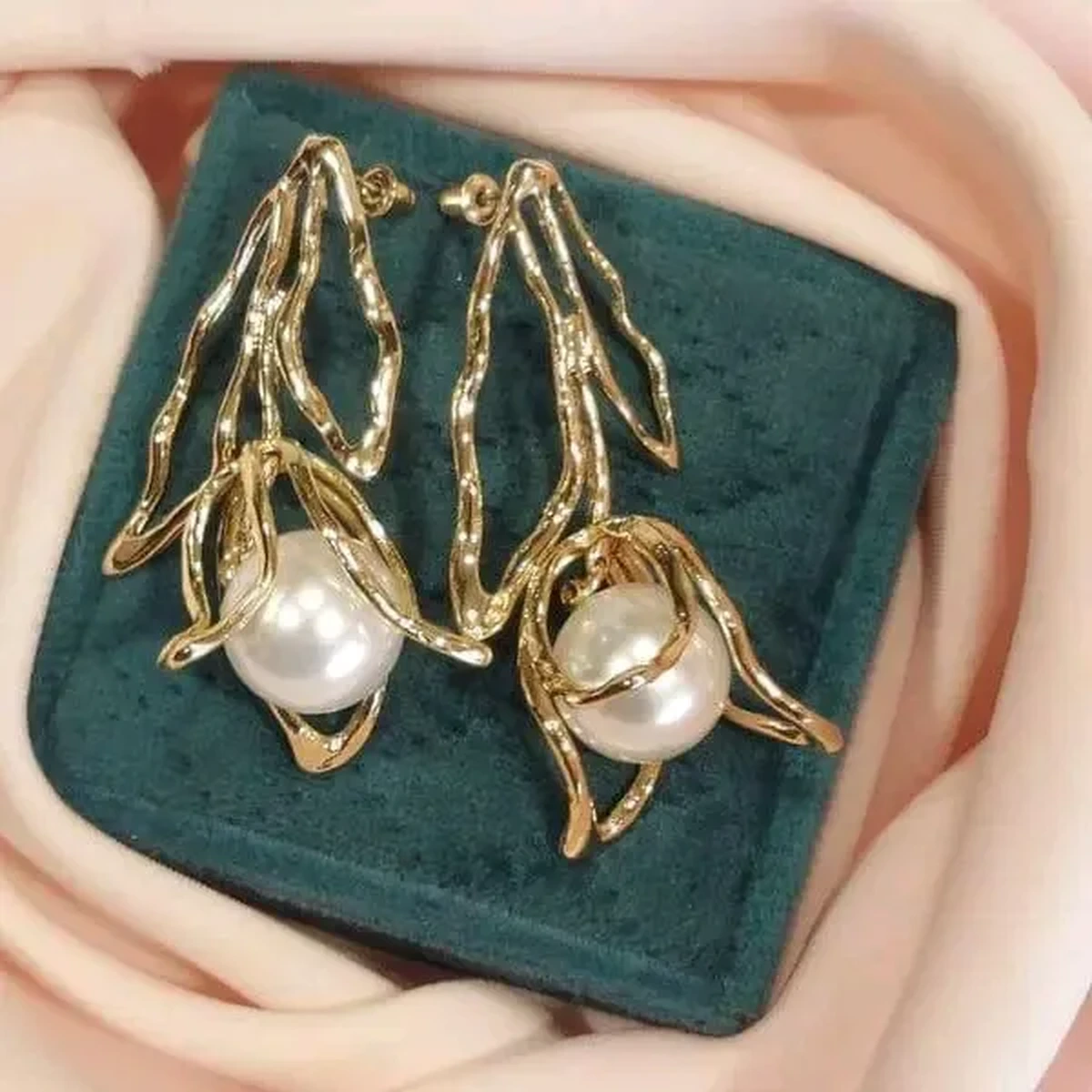 Gold pearl earrings