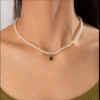 Pearl necklace with green teardrop pendant