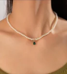 Pearl necklace with green teardrop pendant