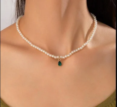 Pearl necklace with green teardrop pendant