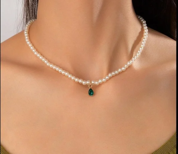 Pearl necklace with green teardrop pendant