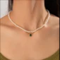 Pearl necklace with green teardrop pendant