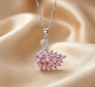Elegant silver necklace with a sparkling pink swan pendant