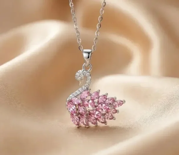 Elegant silver necklace with a sparkling pink swan pendant