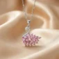 Elegant silver necklace with a sparkling pink swan pendant