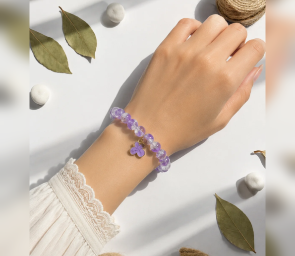 Purple beaded bracelet with flower charm