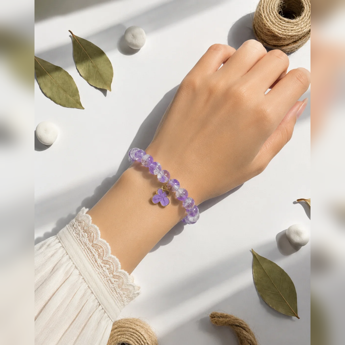 Purple beaded bracelet with flower charm