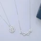 Elegant silver necklaces with heart and floral pendants