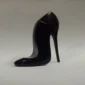 Black stiletto shaped perfume bottle
