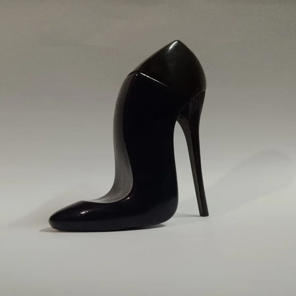 Black stiletto shaped perfume bottle