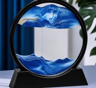 3D moving sand art in blue ocean design with flowing sand waves inside a round glass frame.