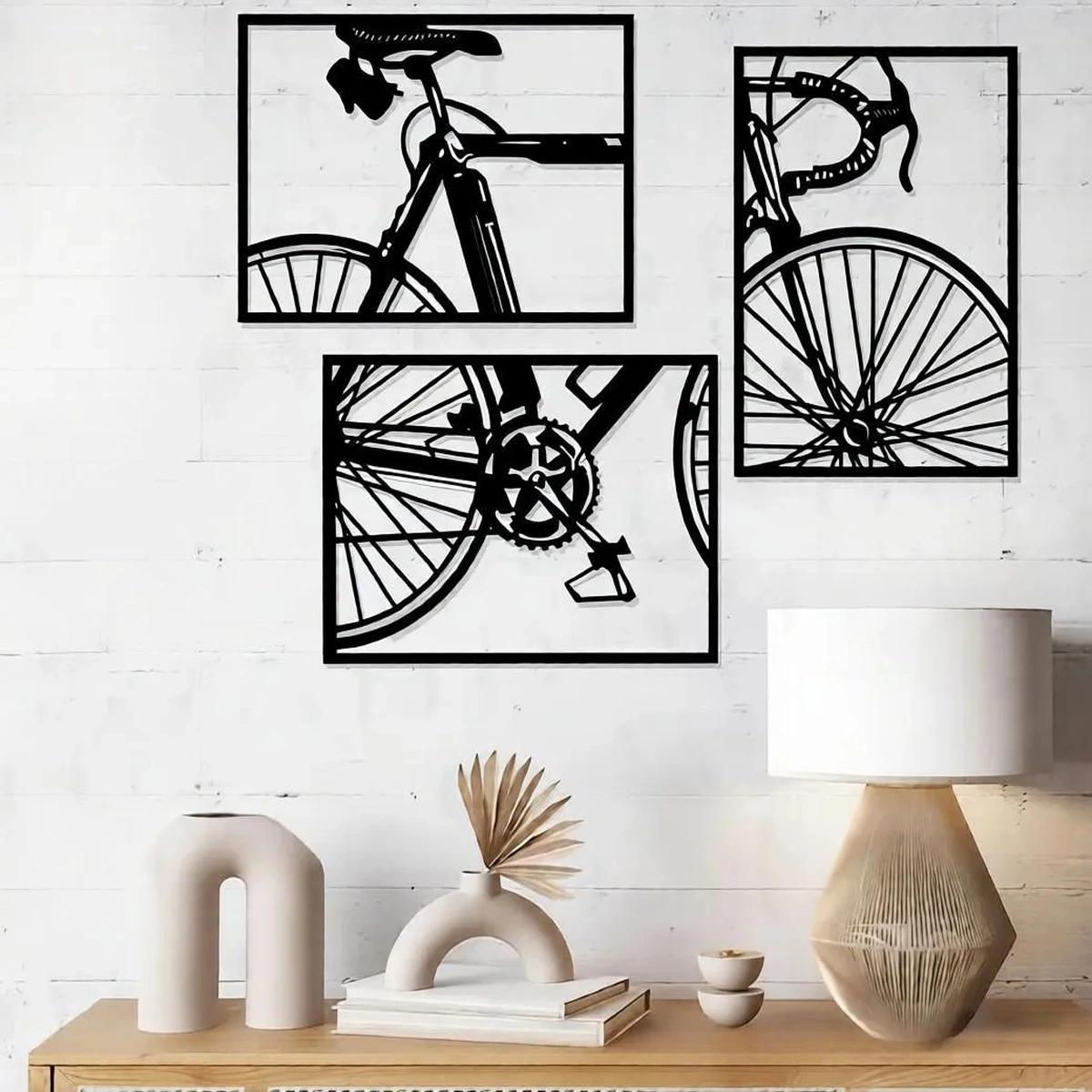 Black and white bicycle wall art set in a modern living room