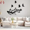 Black tree branch and flying birds wall decor in a modern living room