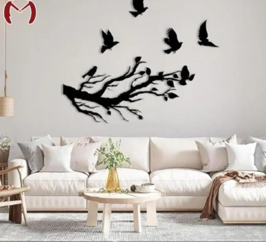 Black tree branch and flying birds wall decor in a modern living room
