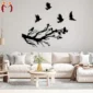 Black tree branch and flying birds wall decor in a modern living room