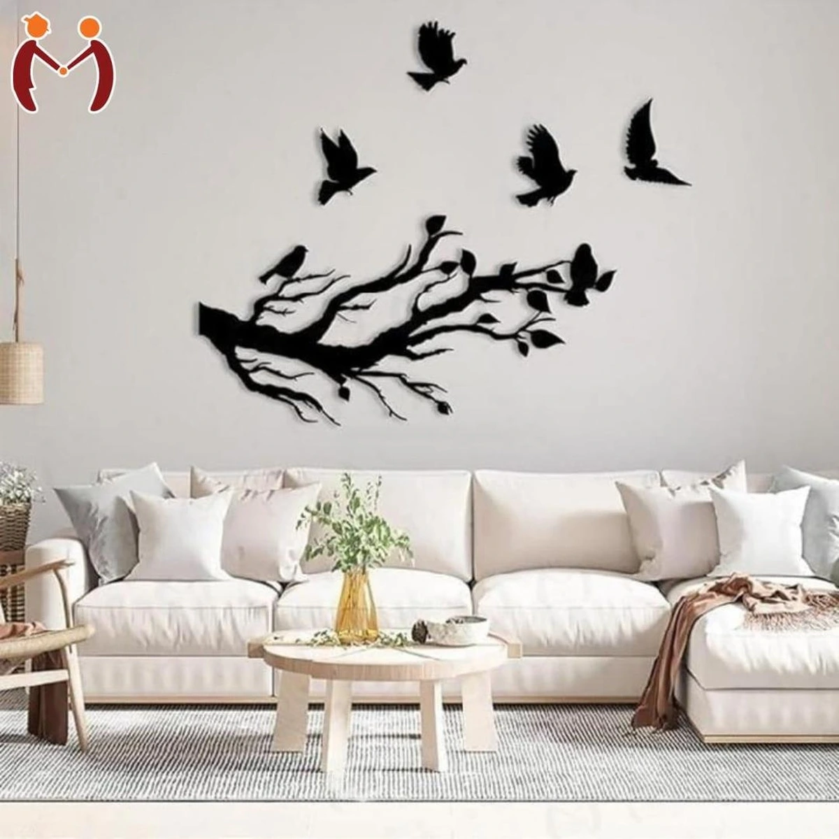 Black tree branch and flying birds wall decor in a modern living room