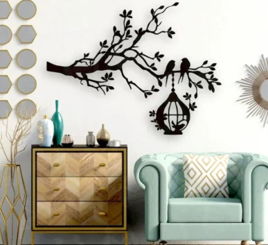 Black tree branch wall decor with birds and hanging birdcage in a modern living room