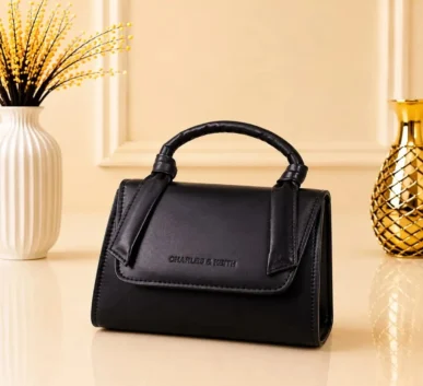 Black structured women’s handbag with top handle