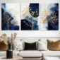 Blue and gold three-panel tree wall art above a modern living room sofa