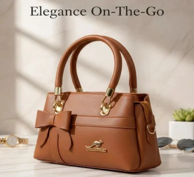 Brown leather handbag with bow design and gold accents