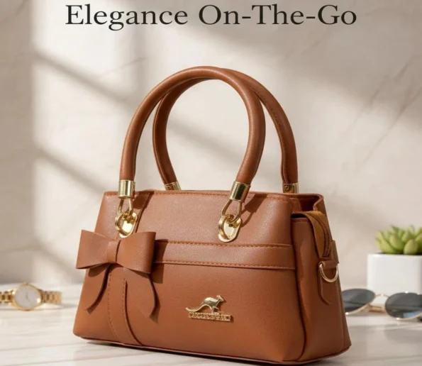 Brown leather handbag with bow design and gold accents