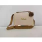 Cream and brown crossbody handbag with top handle and decorative pom pom