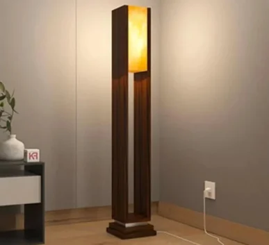 Modern wooden floor lamp with warm ambient light and a tall decorative design for home interiors.