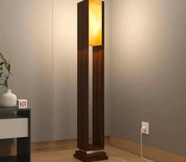 Modern wooden floor lamp with warm ambient light and a tall decorative design for home interiors.