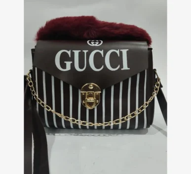 Black and white striped Gucci handbag with fur trim