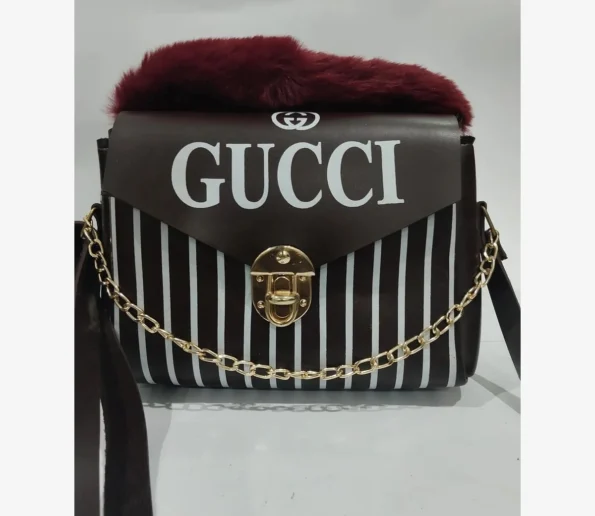Black and white striped Gucci handbag with fur trim
