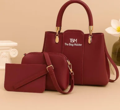 Maroon 3-piece handbag set featuring a handbag, crossbody bag, and matching wallet with gold-tone hardware.