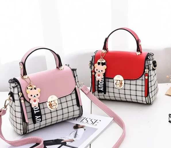 Pink and red women’s handbags with checkered panels