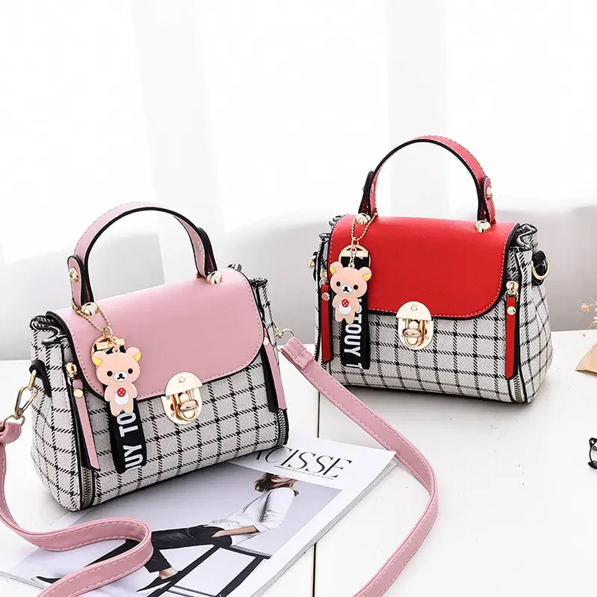 Pink and red women’s handbags with checkered panels