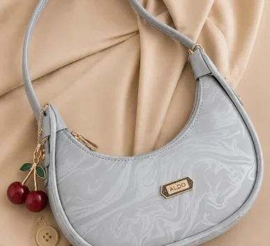Light blue ALDO shoulder bag with cherry charm