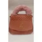 Pink quilted handbag with fluffy faux fur handle and gold-tone LV logo