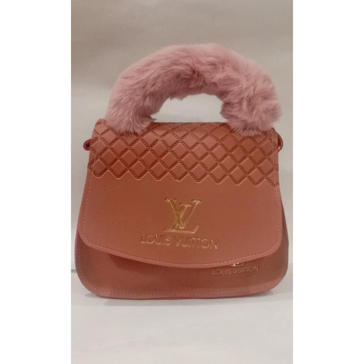 Pink quilted handbag with fluffy faux fur handle and gold-tone LV logo