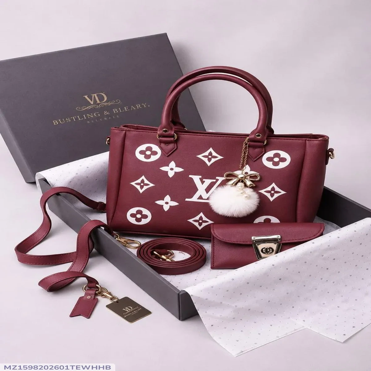 Maroon printed women’s handbag with double handles, adjustable shoulder strap,