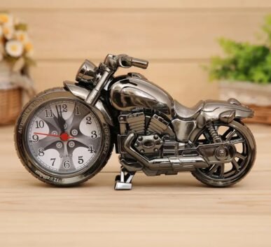 Silver motorcycle-shaped table clock with a detailed analog dial and chrome finish.