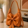 Orange bow shoulder bag for women